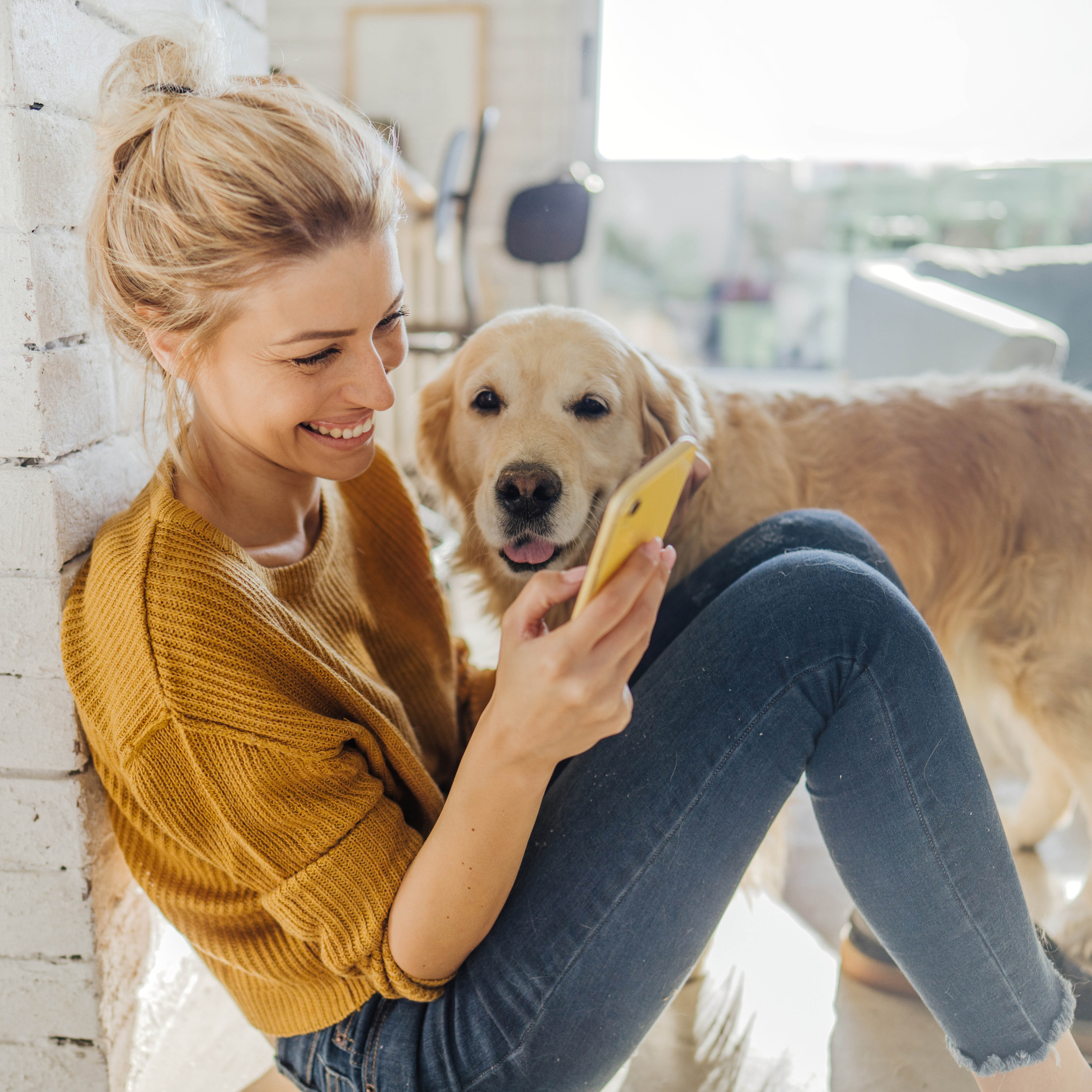woman on phone with her dog