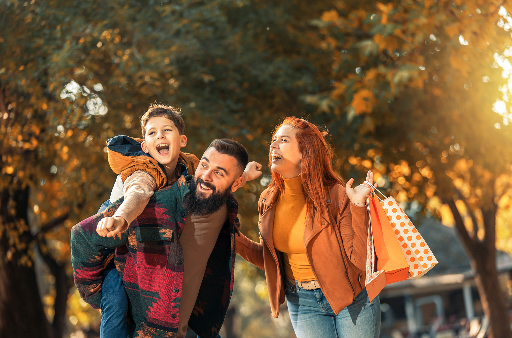 family shopping outdoors in the fall